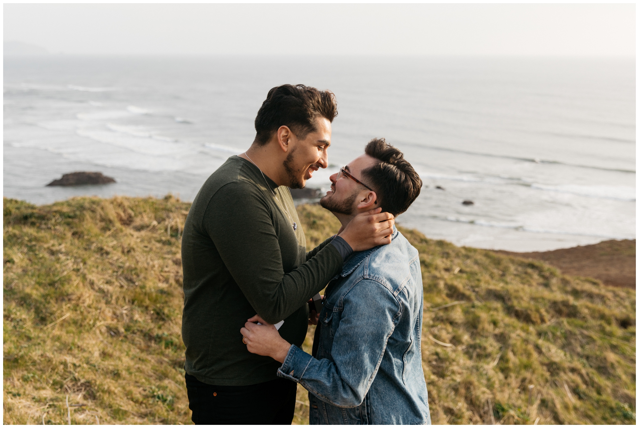 Cannon Beach Engagement With Brittney Hyatt Photography Seattle Wedding and Elopement Photographer. Same-sex couple proposes to each other at Ecola State Park on a cliff side overlooking Cannon Beach. 